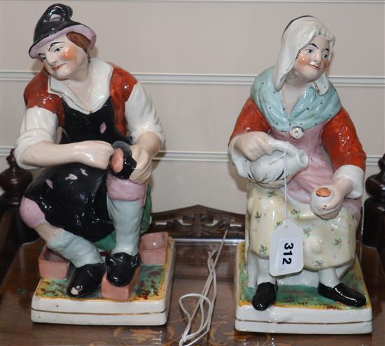 A pair of 19th century Staffordshire large shop window display figures on square bases, H 31cm